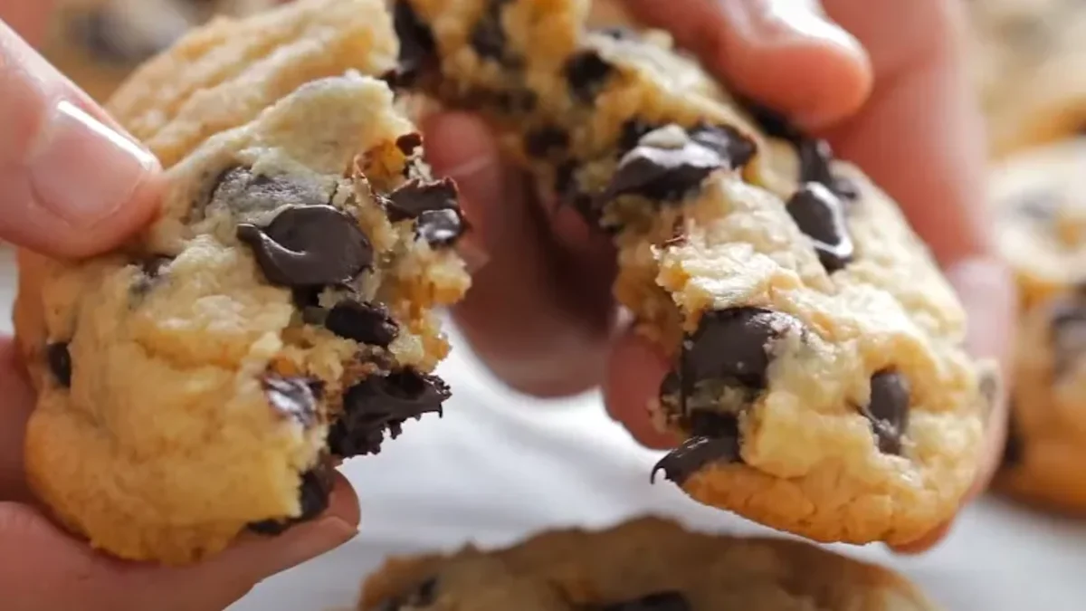 Freshly baked air fryer cookies with golden edges and gooey centers, cooling on a rack and ready to serve.