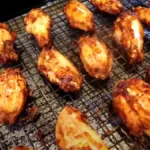 A plate of perfectly cooked and crispy air fryer chicken wings ready to be served.
